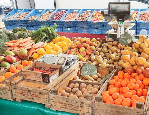 a farmer's market showing fruits